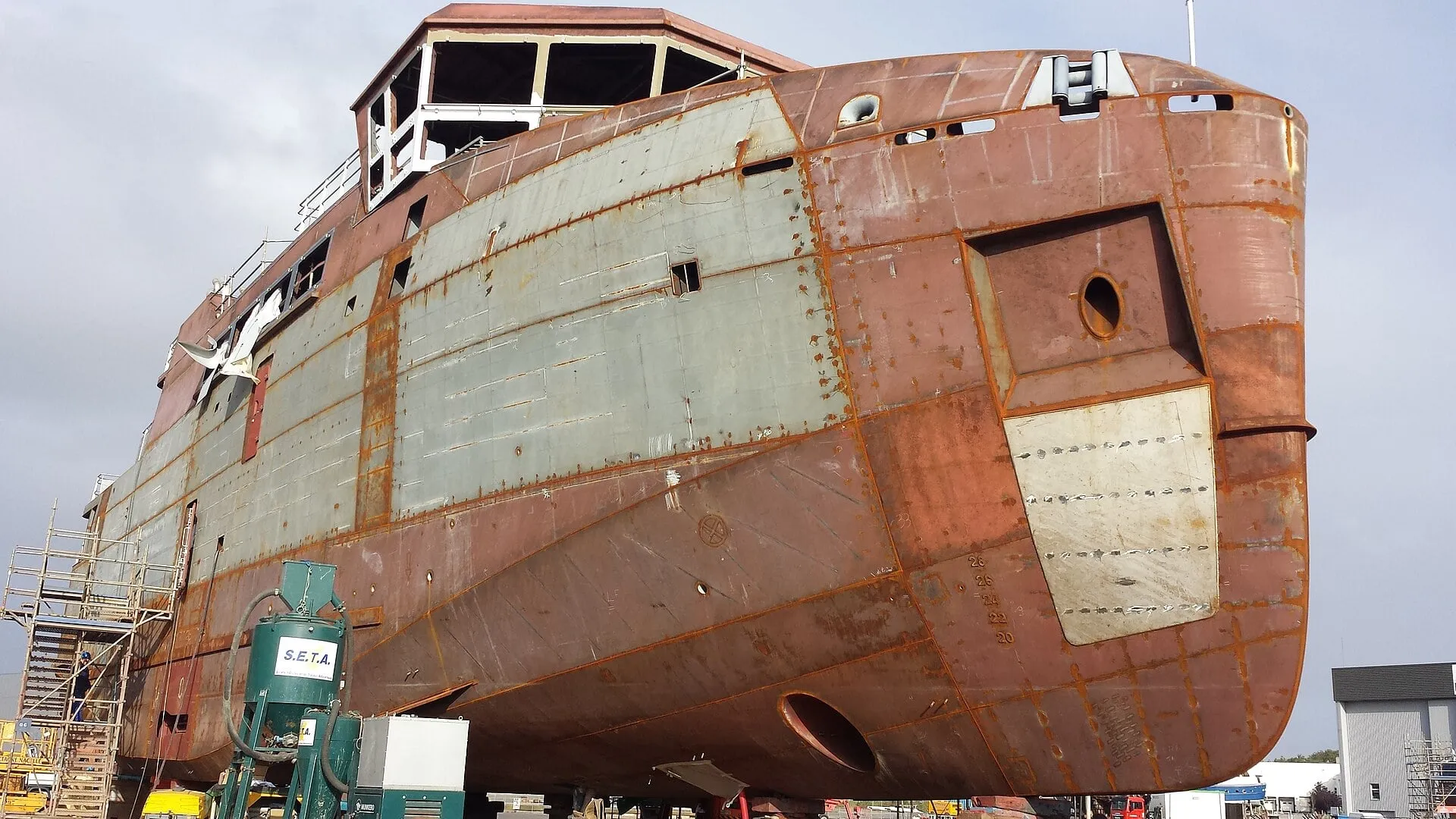 Steel hull under construction at a shipyard