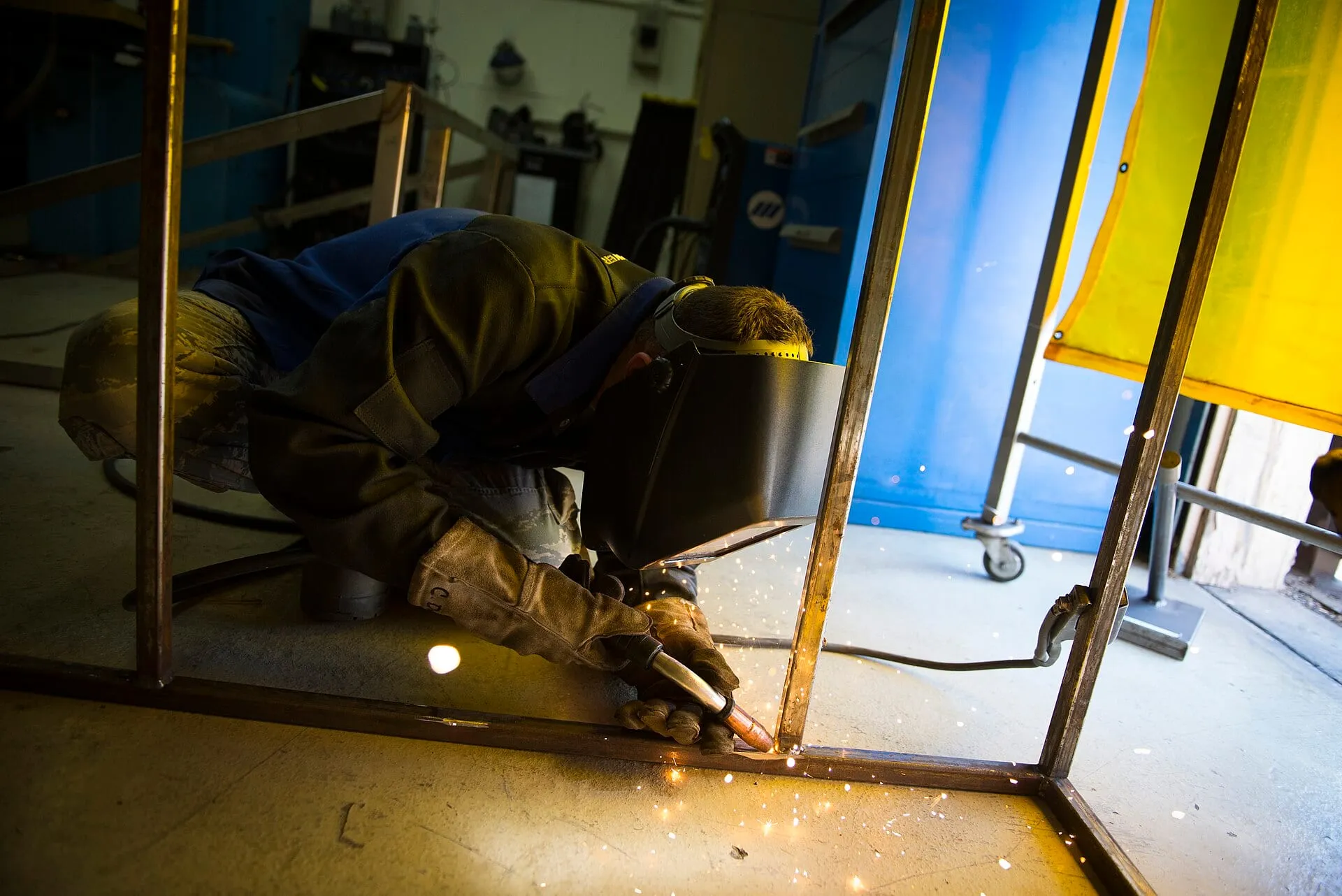 Welder working on a steel frame